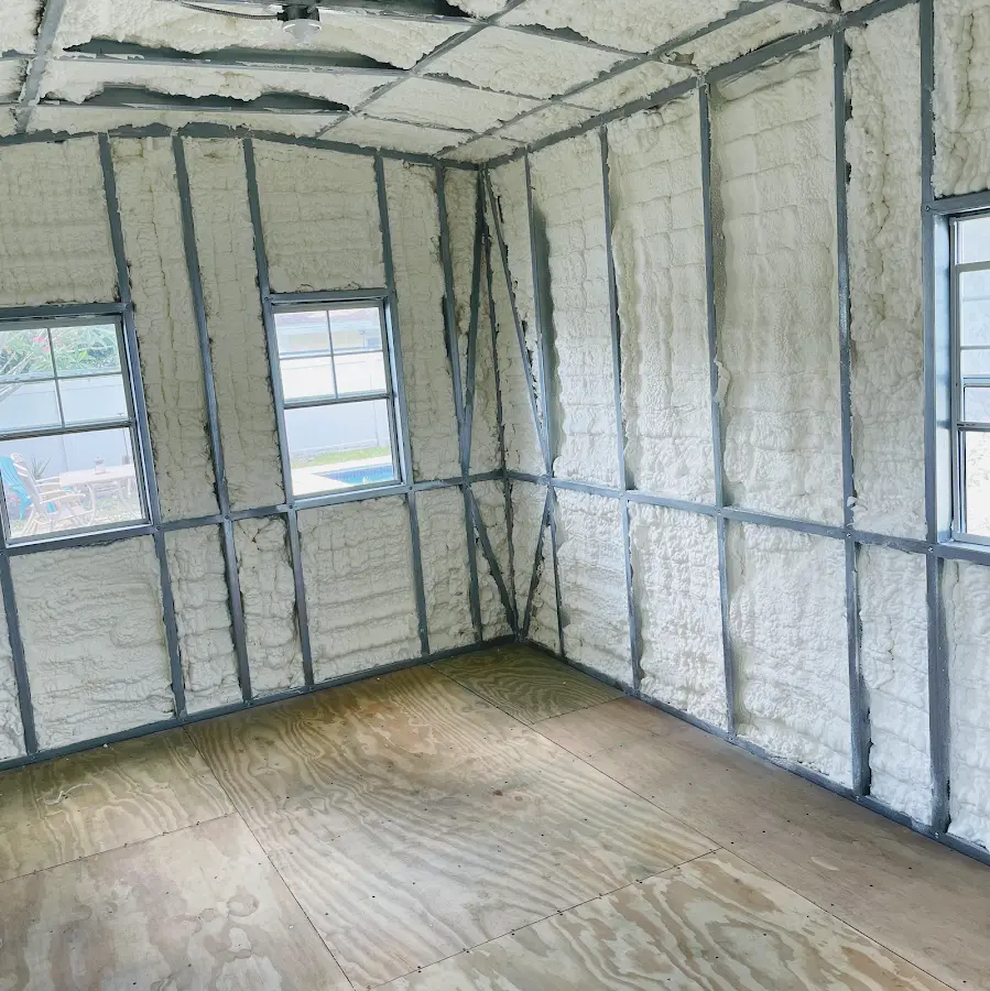 Closed-cell spray foam insulation applied to wall cavities in a residential project in Merrillville